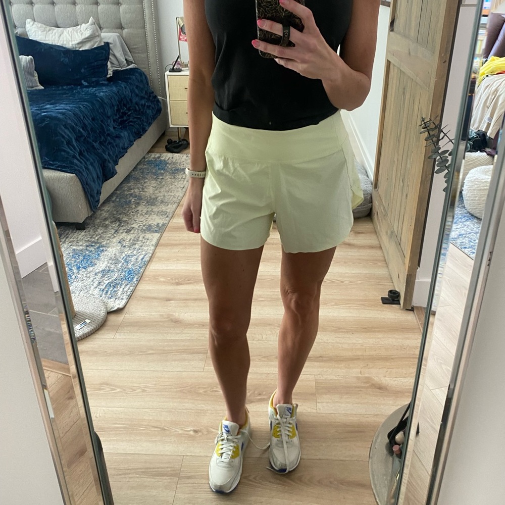 Athlete light yellow running shorts size S